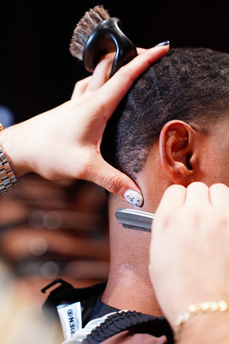 Barber cutting a skin fade at The Upper Seat, men’s haircut in Midtown Manhattan